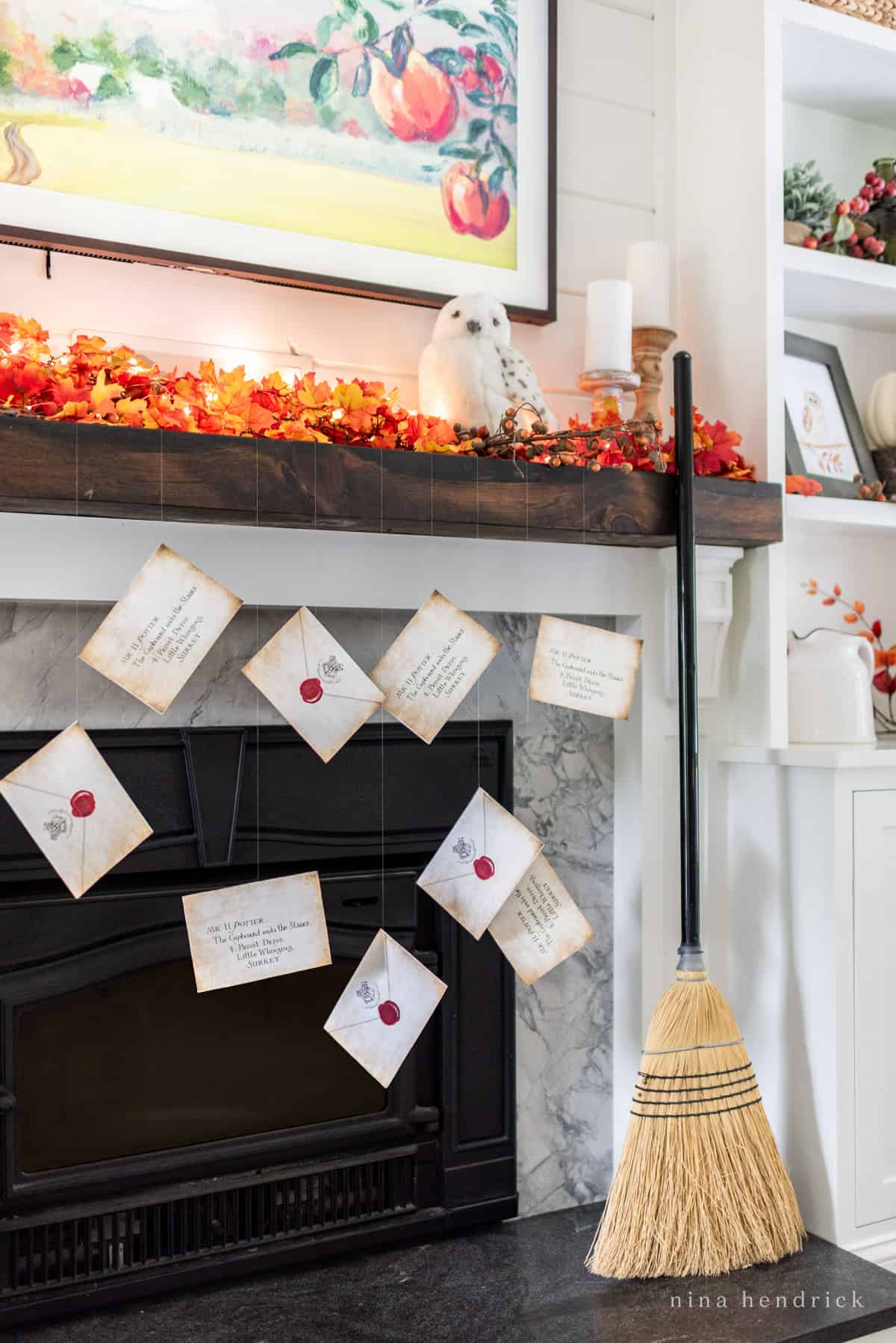 Hogwarts letters hanging from the fireplace for Halloween.