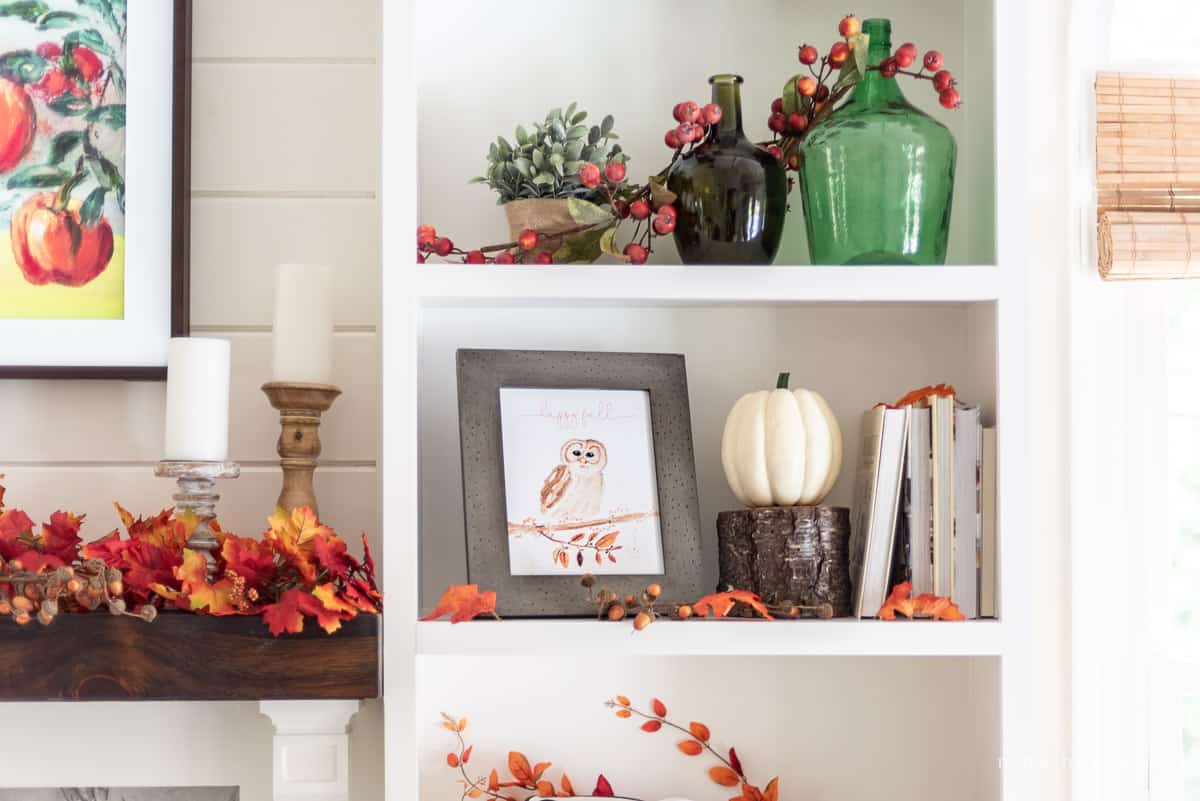 Fall shelf decor near the mantel.