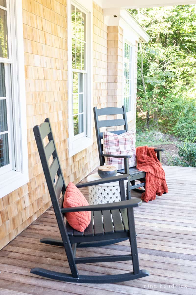 A chair and a table on a front porch will fall textiles.