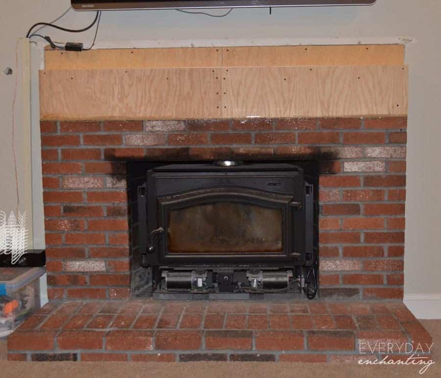 Learn how to cover your brick fireplace to transform it from dated to modern farmhouse style with stone