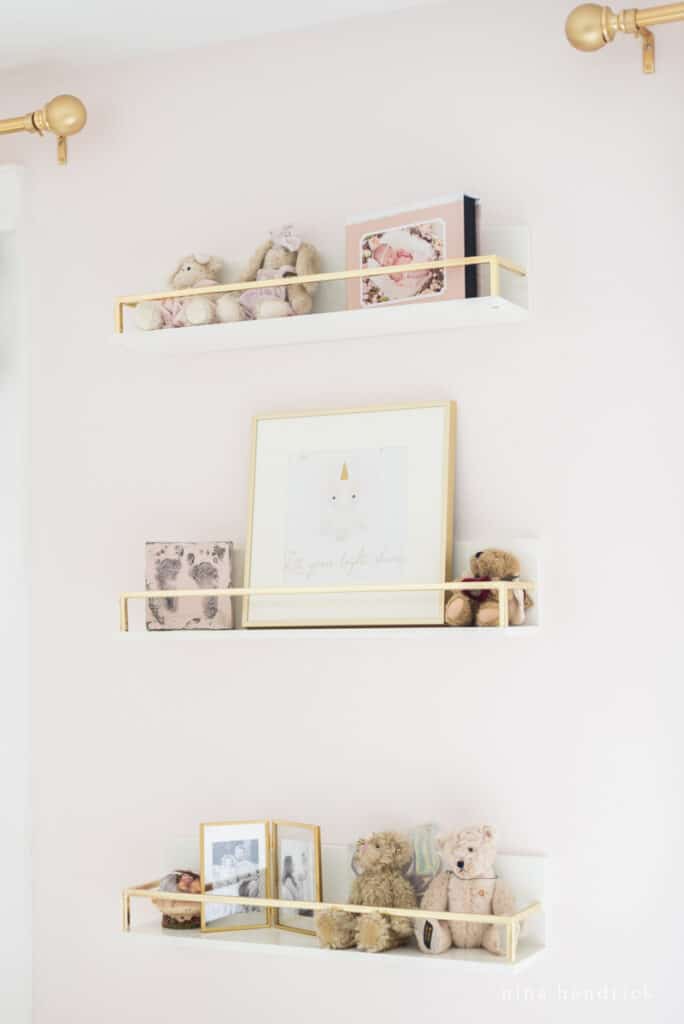 Gold shelves with bears and other sentimental items