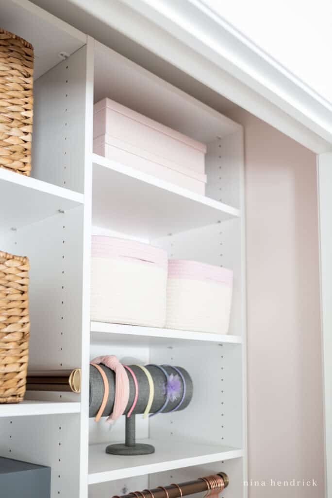 girl organized closet rope baskets