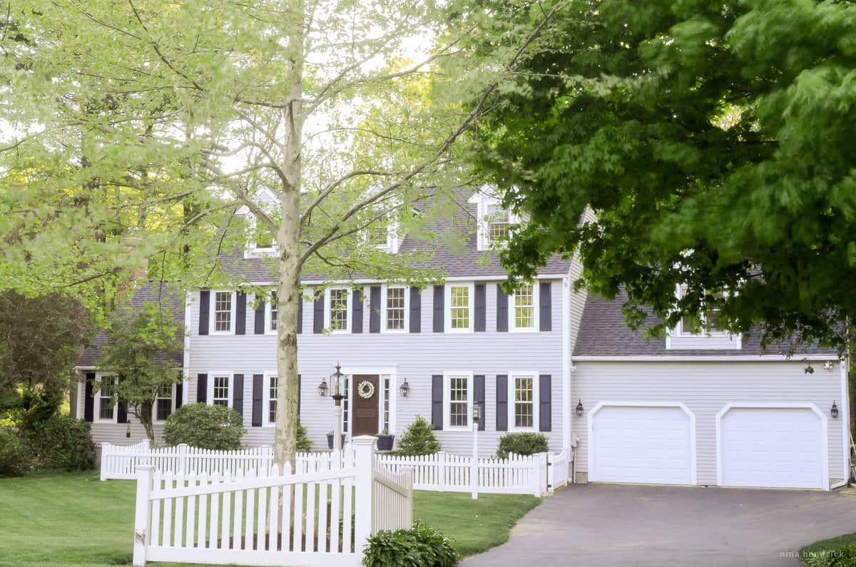 A white house with a picket fence.