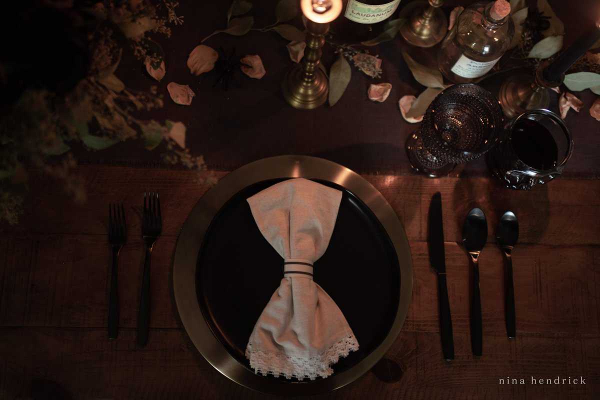 A spooky place setting with a napkin and silverware.