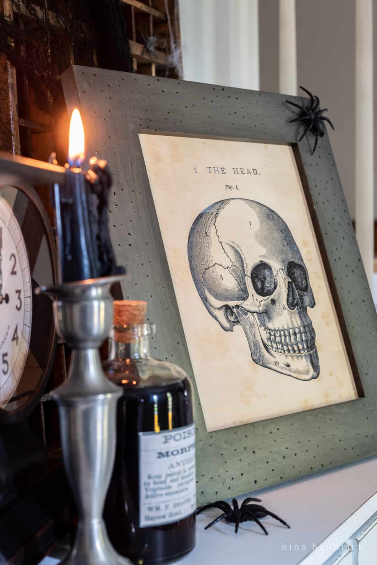 Get into the spooky spirit with this haunting framed print featuring a skull and candle on a mantle. 