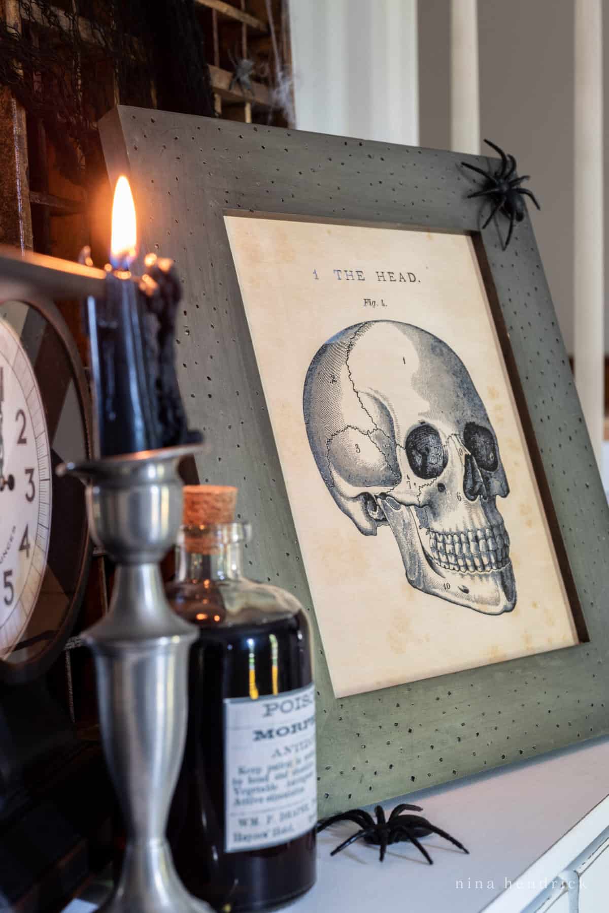Get into the spooky spirit with this haunting framed print featuring a skull and candle on a mantle.