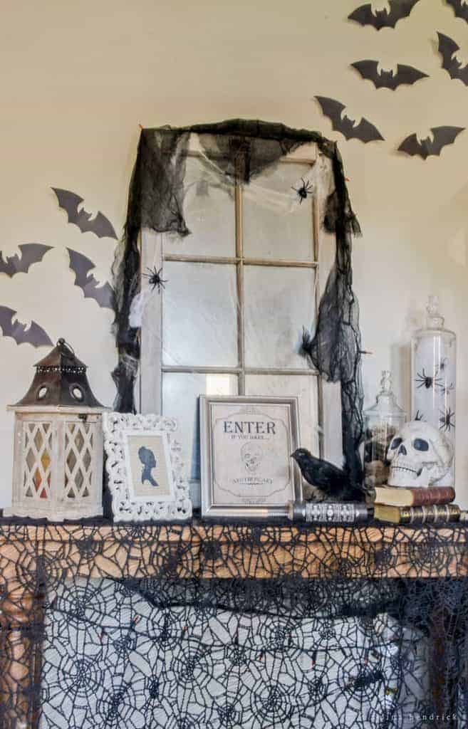 Get creepy crawly decorating inspiration from this vintage-inspired spooky Halloween foyer decor.
