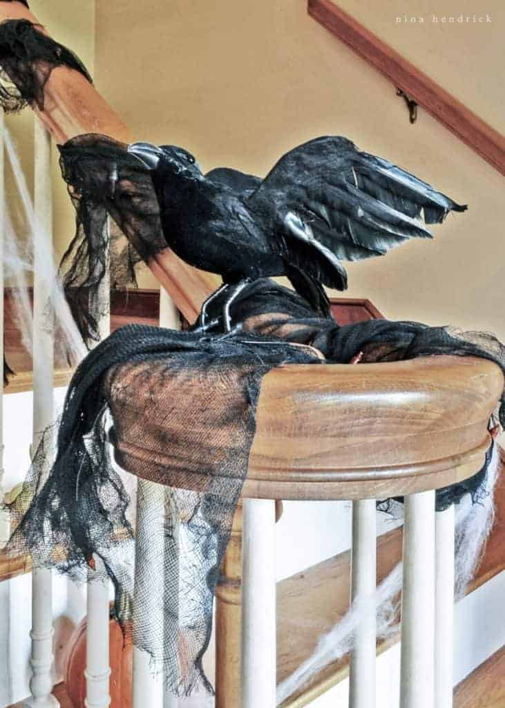Get creepy crawly decorating inspiration from this vintage-inspired spooky Halloween foyer decor.