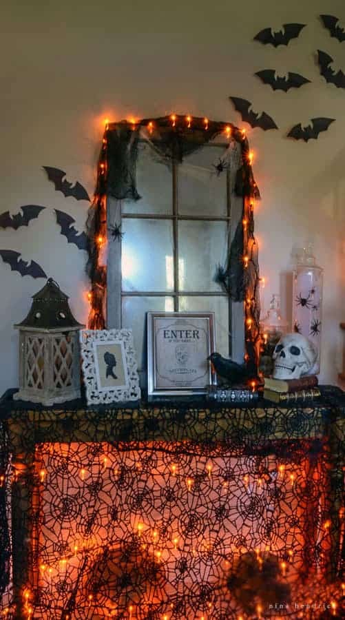 Get creepy crawly decorating inspiration from this vintage-inspired spooky Halloween foyer decor.