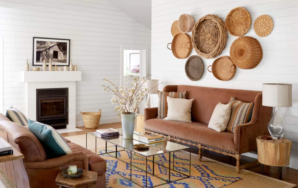 See the inspiration behind a Collected and Contrasting Dining Room Design. This room features a bold wall color, antique finishes, and a ton of texture. 