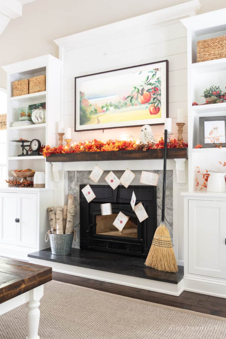 A cozy living room with a fireplace and a broom, reminiscent of the magical world of Hogwarts.