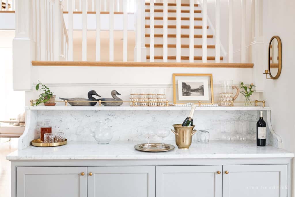 Built-In Home Bar area with Benjamin Moore Coventry Gray cabinets and a Carrara marble top