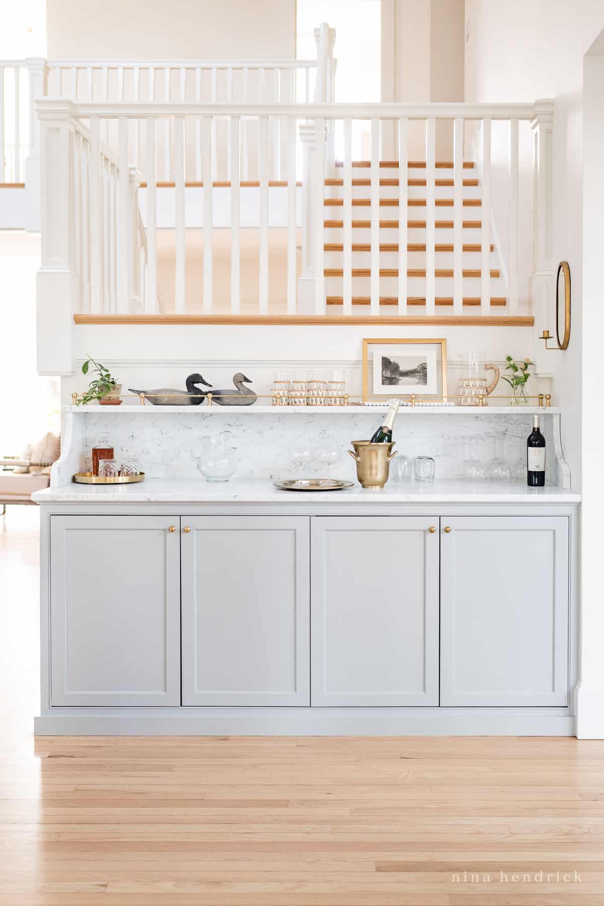 Coventry Gray Built-In bar area with Carrara marble and gallery rail