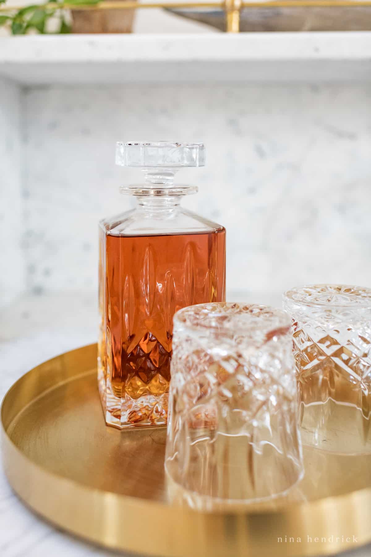 Waterford Whiskey decanter on a modern brass tray