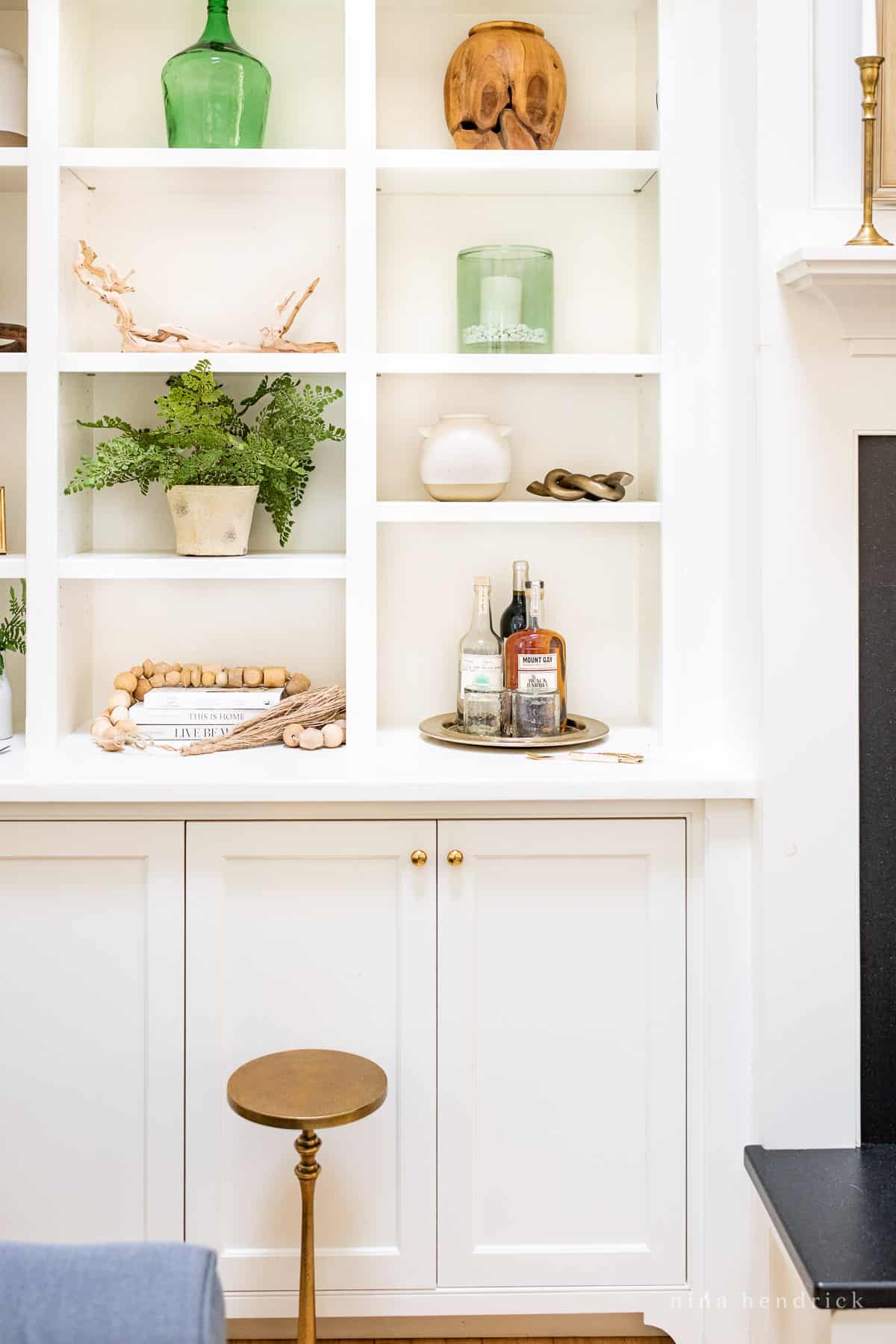 Built-in cabinets with a serving tray on the decorative shelf