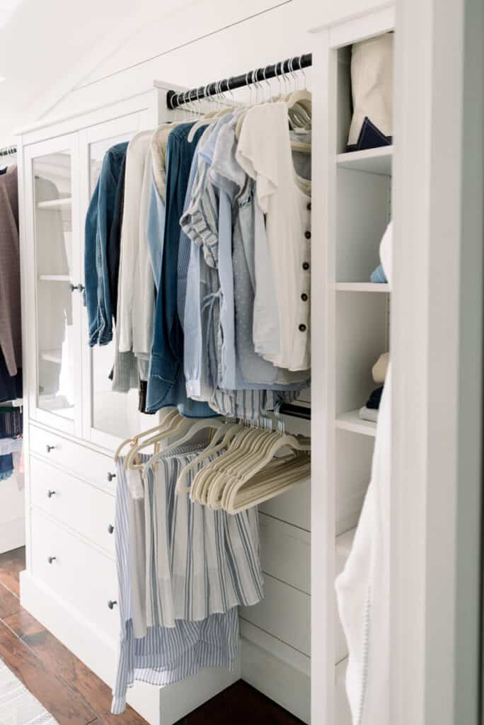 Home Renovation Goals | Organized Closet with blue capsule wardrobe and white cabinets
