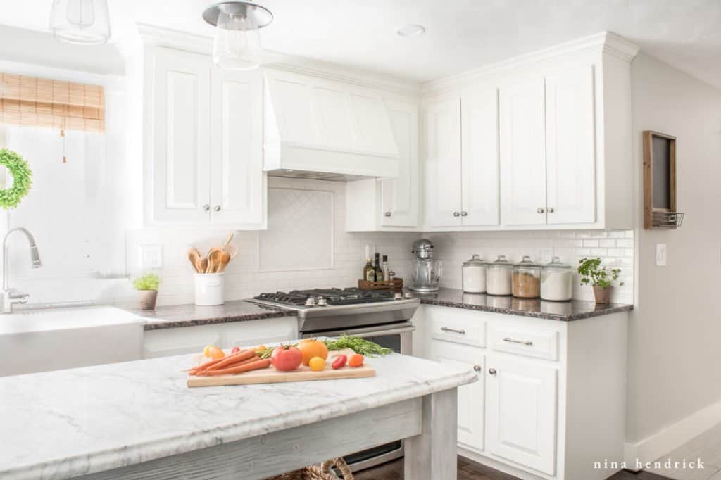 How to Paint Oak Cabinets for a high-end white kitchen on a budget