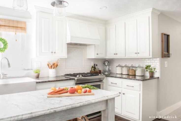 White Painted Kitchen | Learn how to paint oak cabinets and hide the grain to achieve a completely smooth and professional finish.