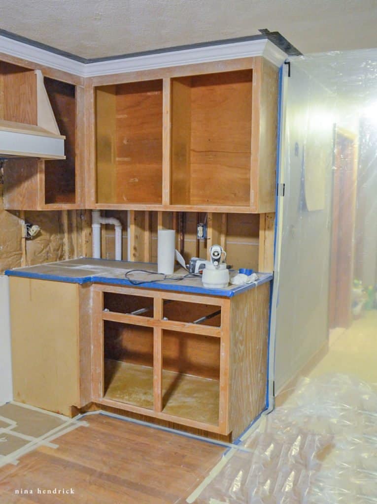 How to Paint Oak Cabinets Tutorial: Tape and Seal Off Your Kitchen to Protect from Overspray