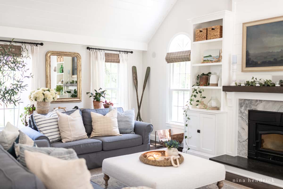 Family room with comfy sofas and an ottoman with a wicker tray