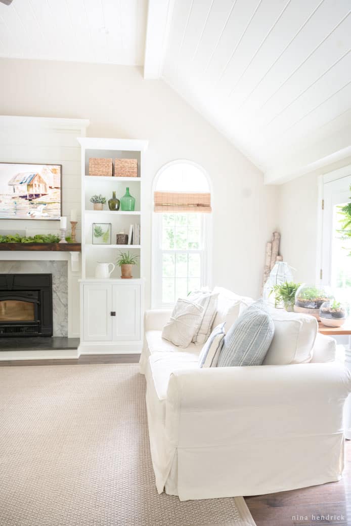 Living room with a white sofa and bright natural light