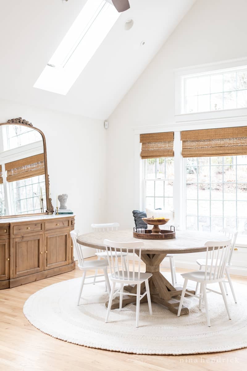 Eat-in kitchen area with round rug and white chairs with White Dove walls