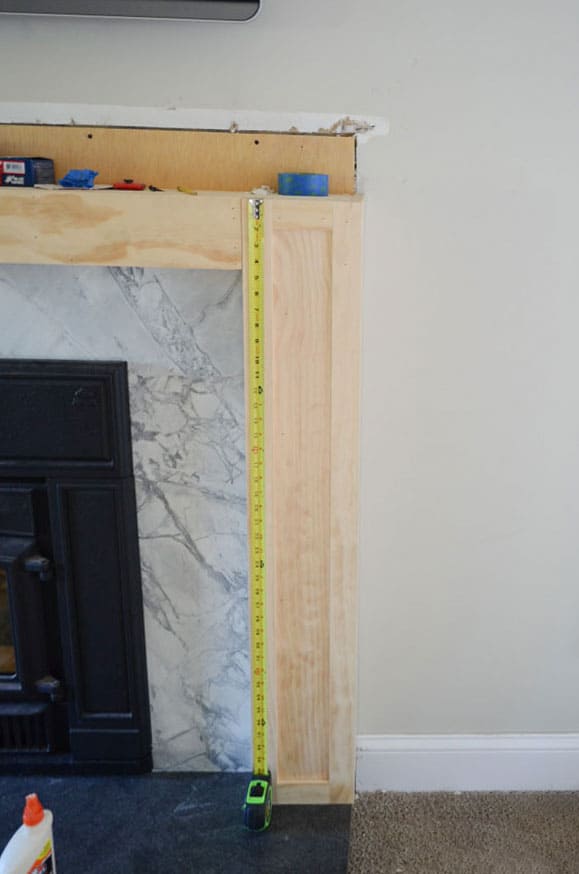 Adding pine trim box detail to a DIY wood fireplace surround