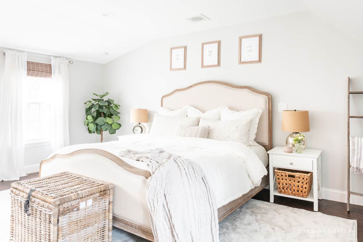 Primary bedroom with soft, neutral bedding