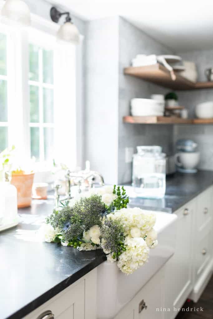 fresh summer Flowers in a sink — hydrangeas