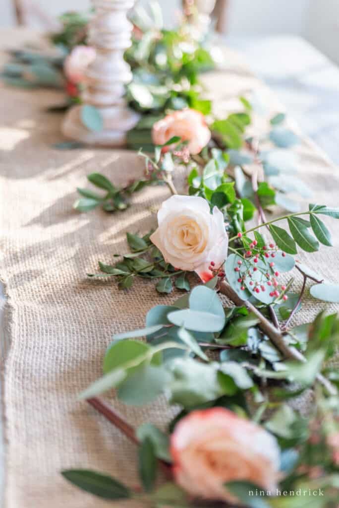 roses, pepper berries, and seeded eucalyptus Valentine's Day centerpiece. 