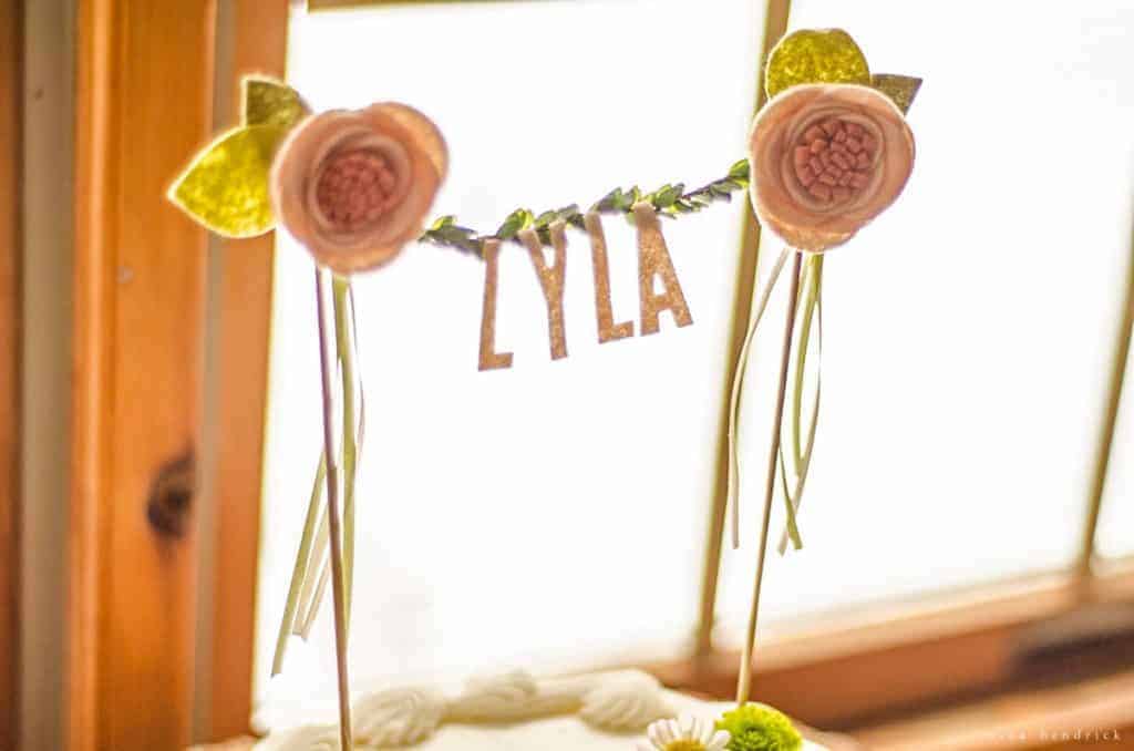 Gather inspiration from this sweet and simple woodland floral first birthday party. Inexpensive grocery store cake and flowers pair with handmade finds to create a unique event.