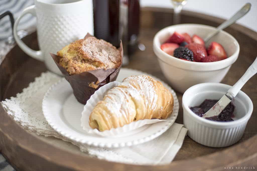 Fresh fruit and pastries on a breakfast tray