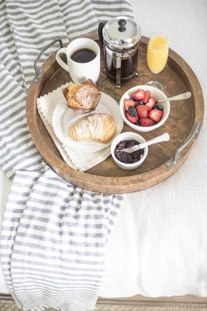 breakfast in bed tray for mother's day inspiration with a mimosa and coffee