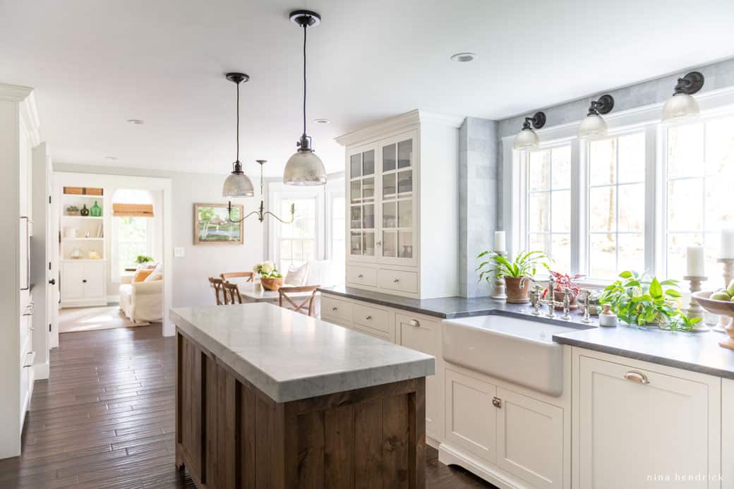 Mixing metals in the kitchen with polished nickel hardware and black light fixtures. 