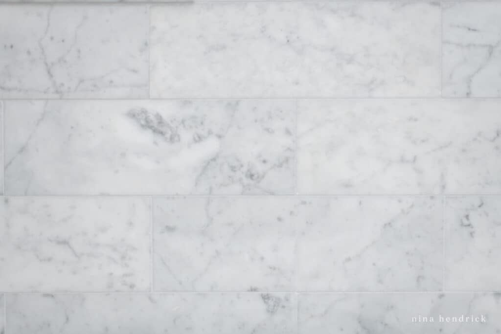 Marble subway tile in a bathroom