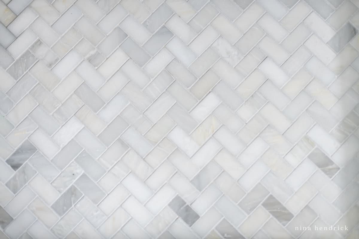 Herringbone marble floor tile