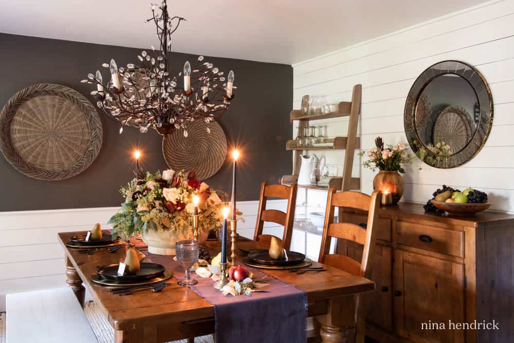 Dining Room decorated with a moody fall tablescape.