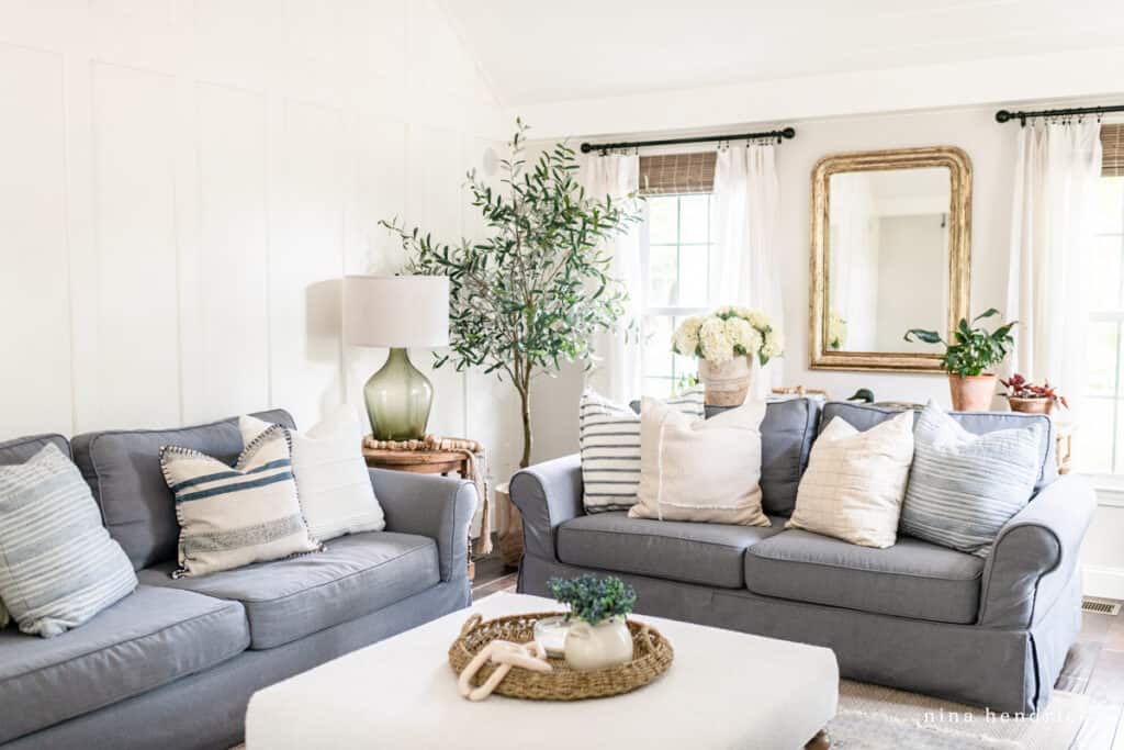 Family Room Makeover with gray slipcovered sofas