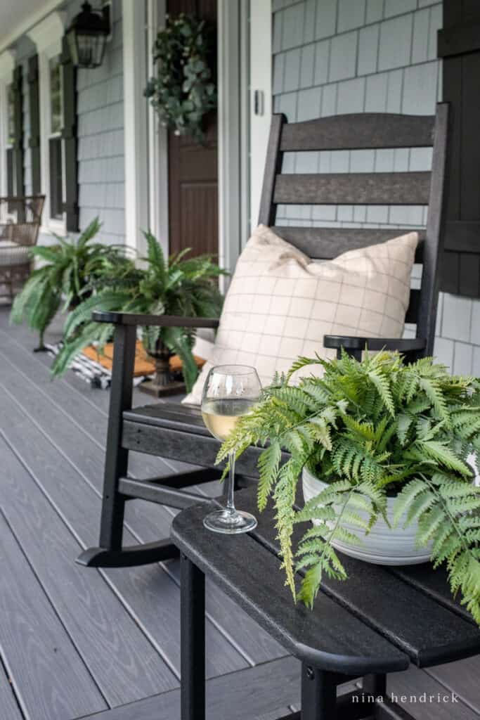 relaxing porch rocking chairs with a glass of wine