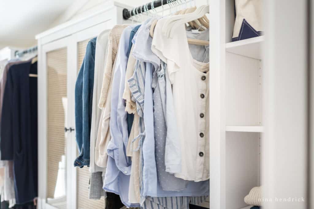 organized closet makeover with hanging blouses