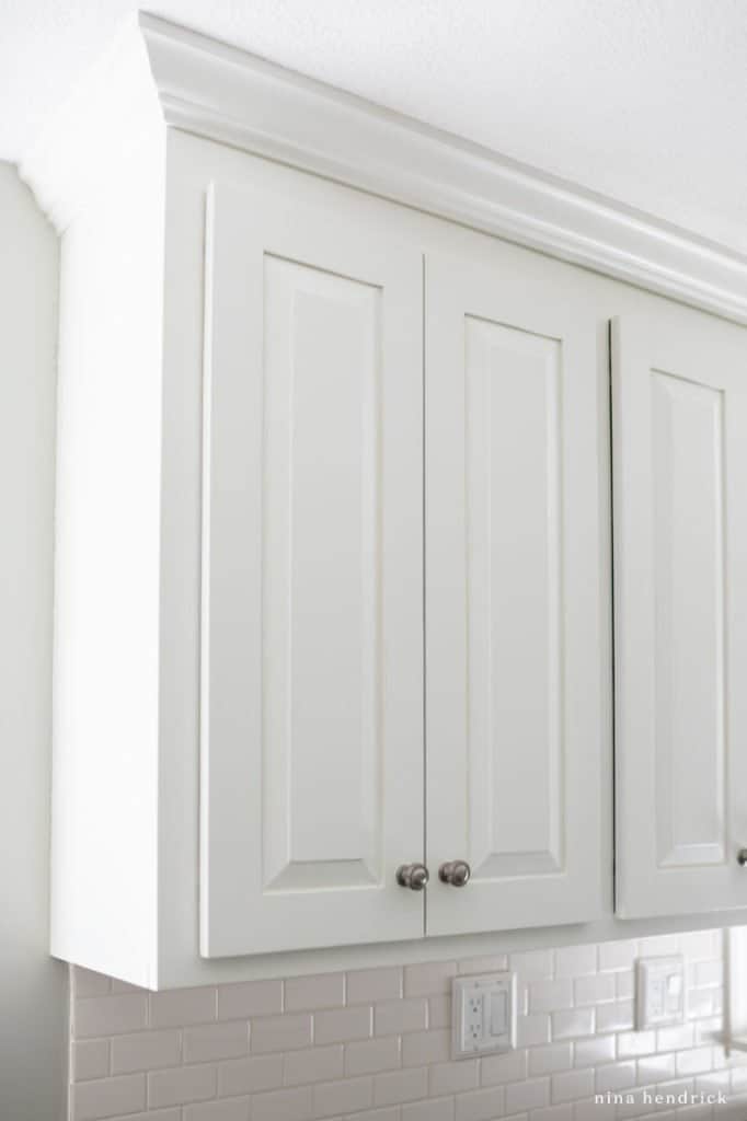 closeup of white painted cabinets five years later