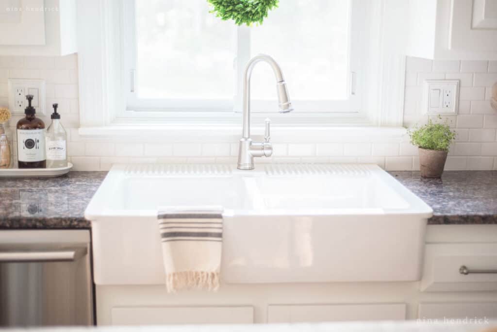 Painted Oak Cabinets and granite countertop with apron sink