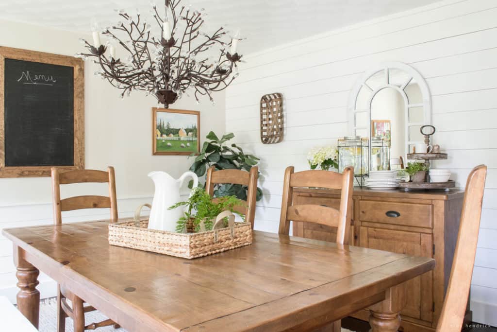 See the inspiration behind a Collected and Contrasting Dining Room Design. This room features a bold wall color, antique finishes, and a ton of texture.