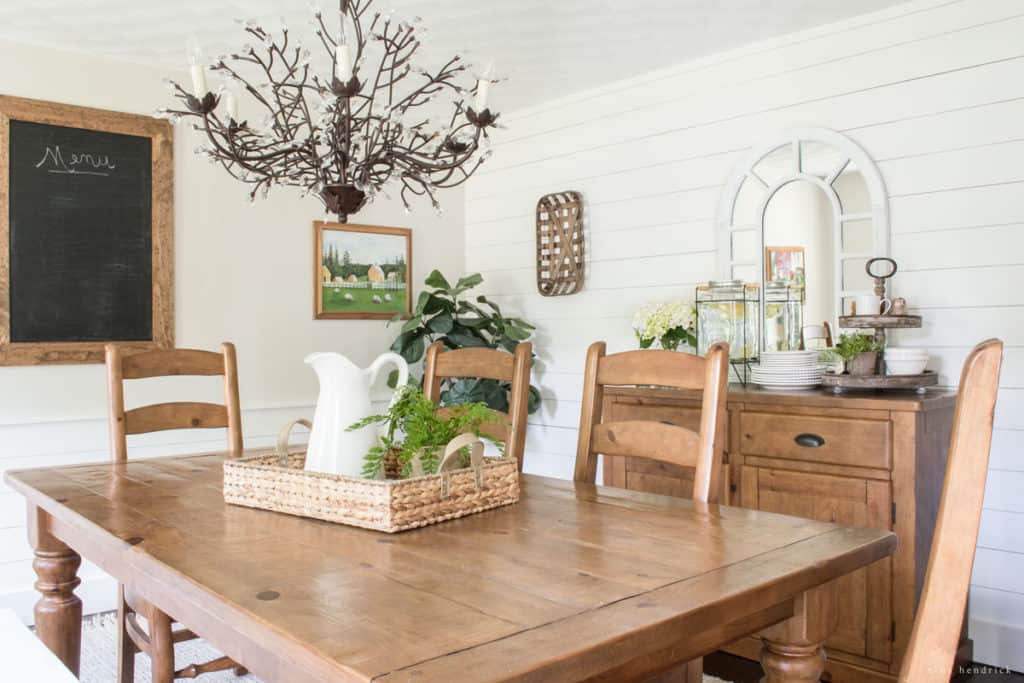 See the inspiration behind a Collected and Contrasting Dining Room Design. This room features a bold wall color, antique finishes, and a ton of texture. 