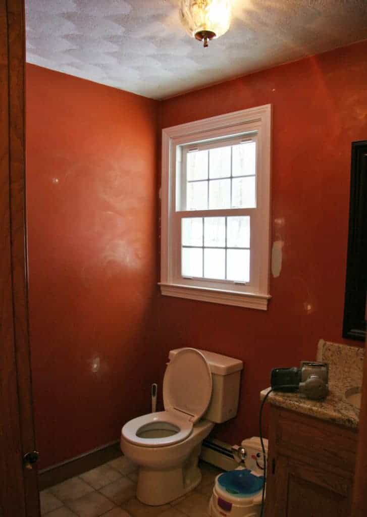 Dated orange powder room before makeover