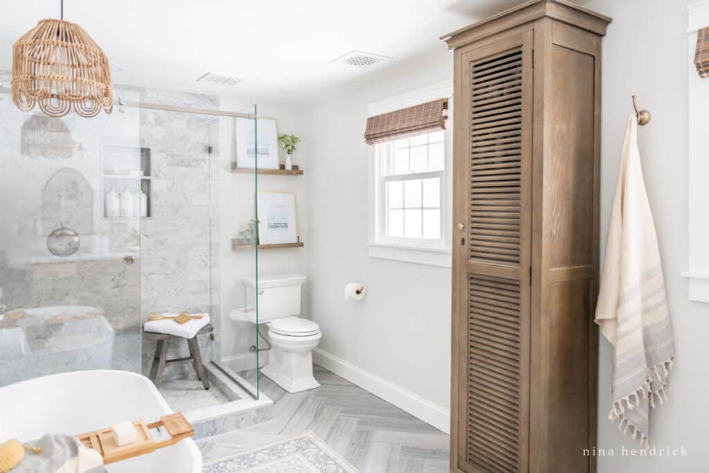 Primary Bathroom Makeover with rustic wood and herringbone floors