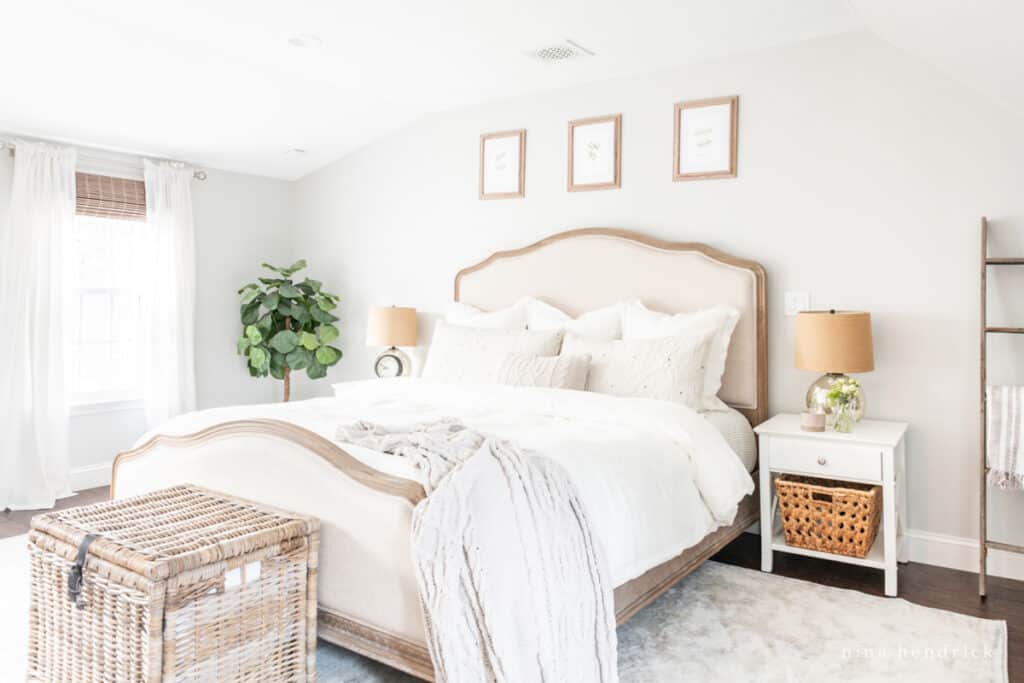 white nightstands with a wood & upholstered bed