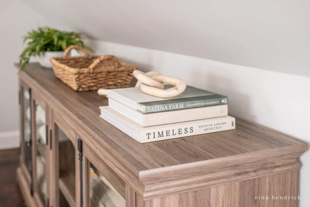 linen cabinet with decor books