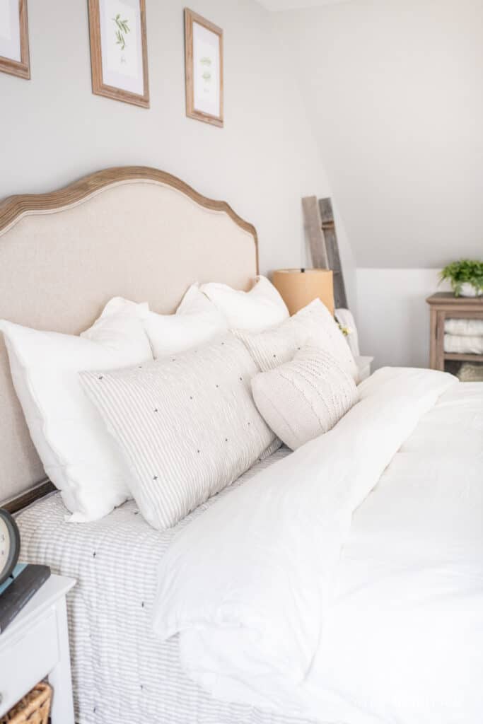 Neutral linen and ticking stripe bedding