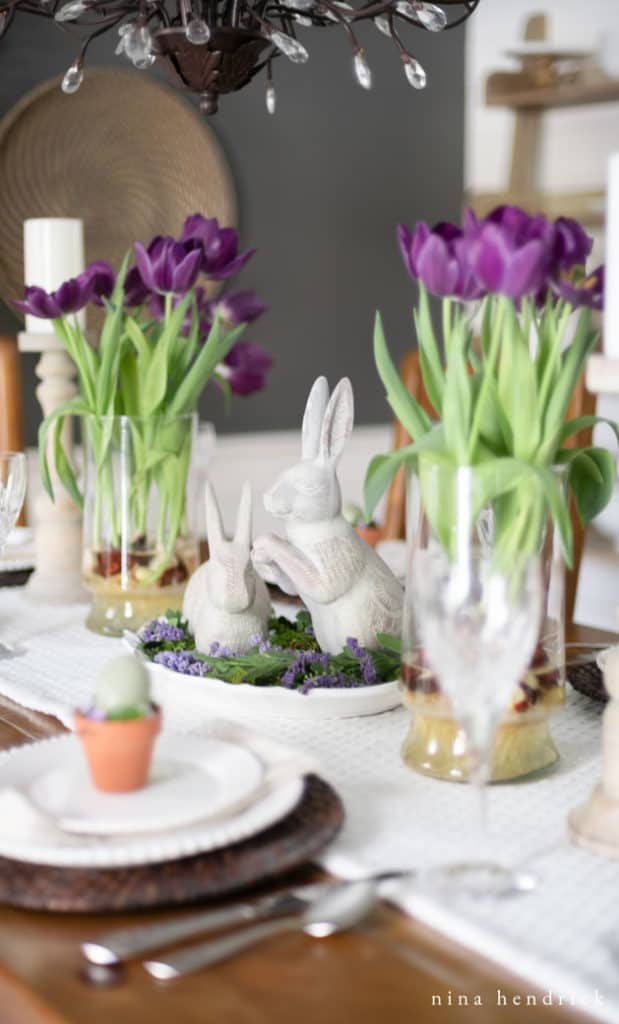 Purple spring tablescape with tulips and bunnies.